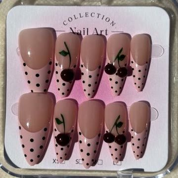 Nude nails with black polka dots and glossy cherry charms