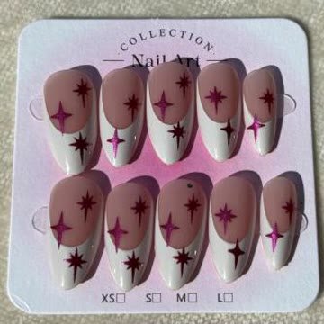 Pink and white French nails scattered with magenta sparkle stars