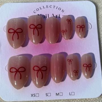Soft pink nails with delicate hand painted red bows
